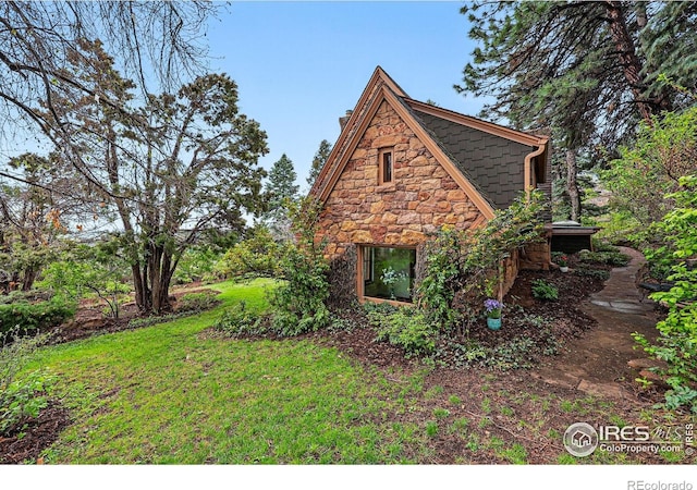1025 5th St, Boulder, CO 80302 - view of side of property with a yard and stone siding