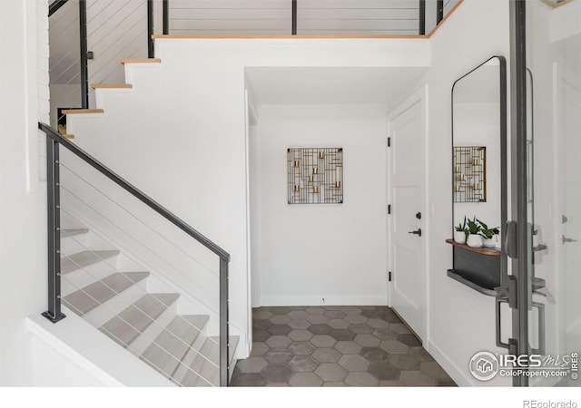 3809 Howe Ct, Boulder, CO 80301 - foyer featuring dark tile patterned flooring and stairway