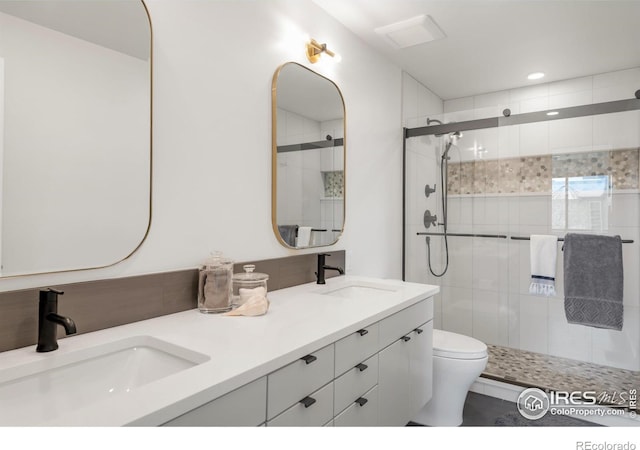 3809 Howe Ct, Boulder, CO 80301 - full bath featuring double vanity, toilet, a shower stall, and a sink