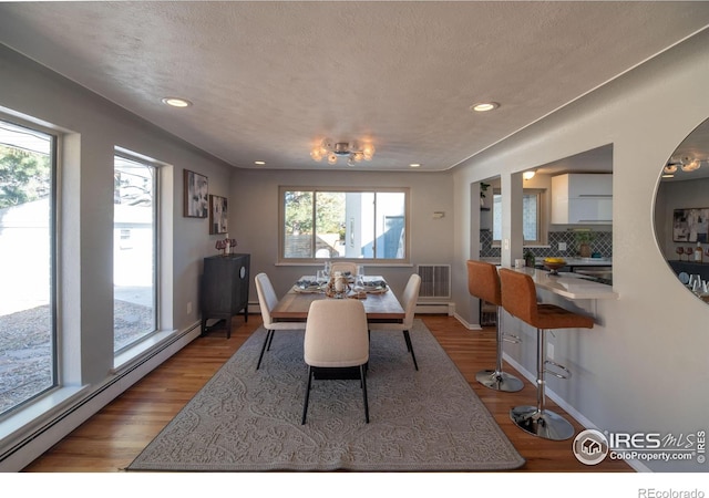 2605 Crabapple Ct, Golden, CO 80401 - dining area with visible vents, recessed lighting, wood finished floors, and baseboard heating