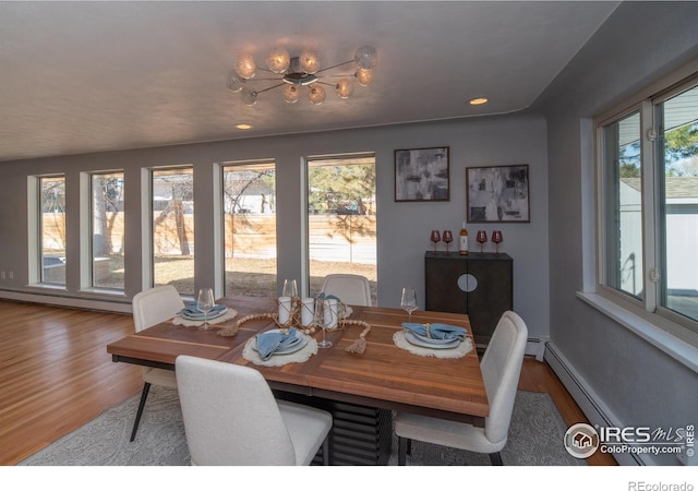 2605 Crabapple Ct, Golden, CO 80401 - dining space featuring wood finished floors, recessed lighting, a baseboard heating unit, and a notable chandelier
