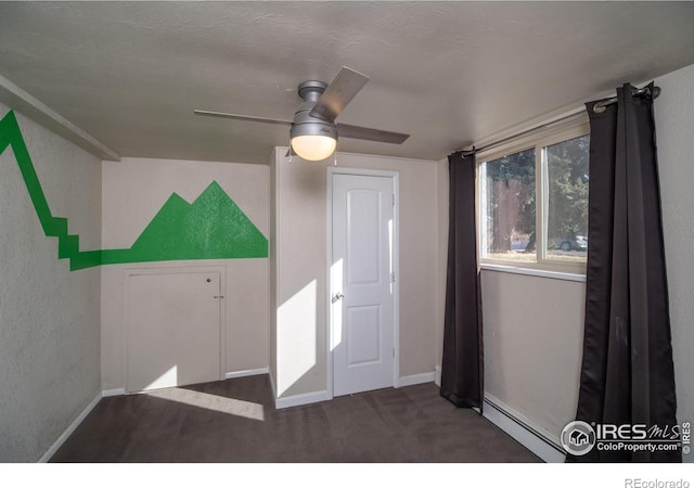 2605 Crabapple Ct, Golden, CO 80401 - carpeted empty room with baseboards, ceiling fan, and baseboard heating