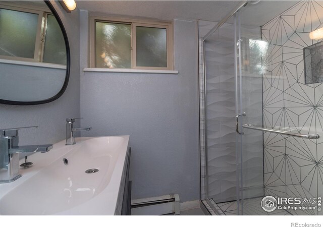 2605 Crabapple Ct, Golden, CO 80401 - bathroom featuring a baseboard heating unit, a shower stall, and vanity