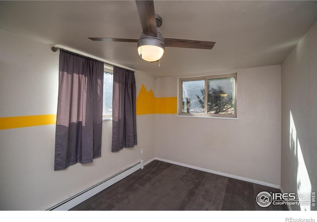 2605 Crabapple Ct, Golden, CO 80401 - unfurnished room with baseboards, a baseboard radiator, dark colored carpet, and ceiling fan