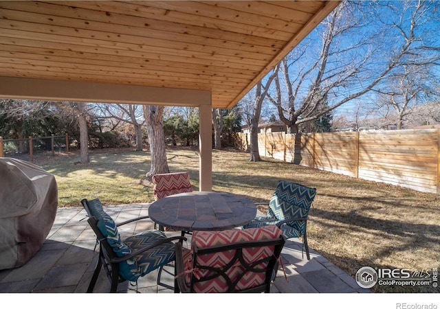 2605 Crabapple Ct, Golden, CO 80401 - view of patio / terrace with outdoor dining area, a fenced backyard, and a grill