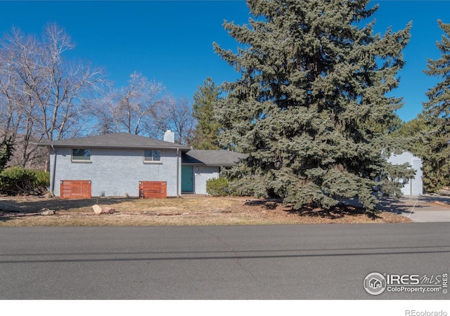 2605 Crabapple Ct, Golden, CO 80401 - view of front of property featuring a chimney and brick siding