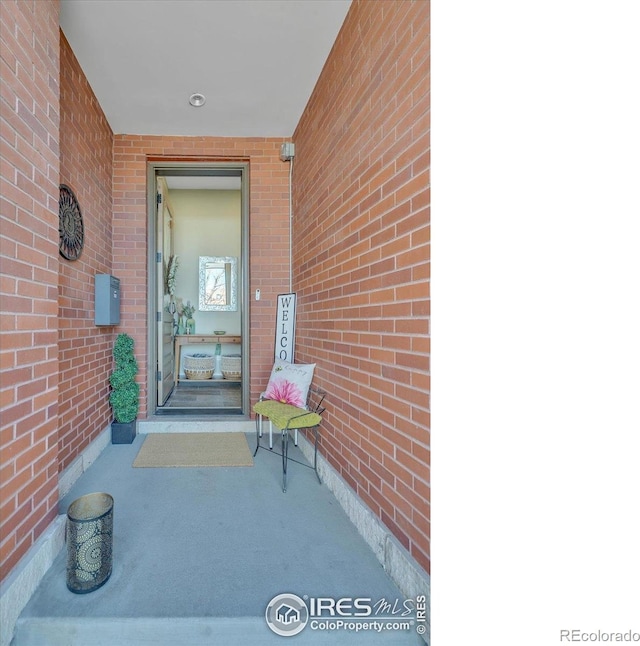2890 Curtis St, Denver, CO 80205 - doorway to property with brick siding