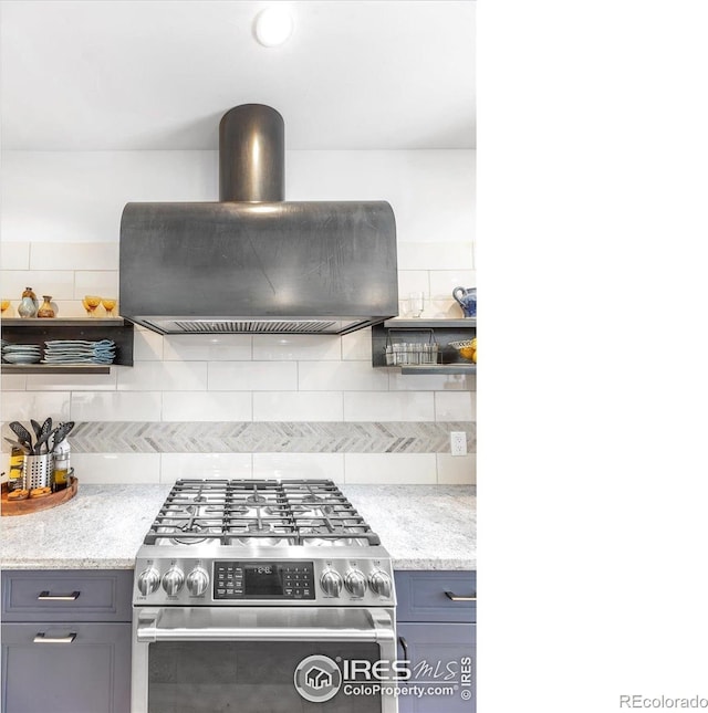 2890 Curtis St, Denver, CO 80205 - kitchen with stainless steel gas stove, island exhaust hood, gray cabinetry, and open shelves