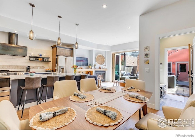 2890 Curtis St, Denver, CO 80205 - dining area featuring recessed lighting and light wood-style floors