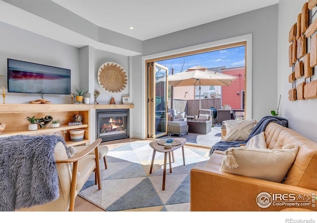 2890 Curtis St, Denver, CO 80205 - living room with wood finished floors and a glass covered fireplace