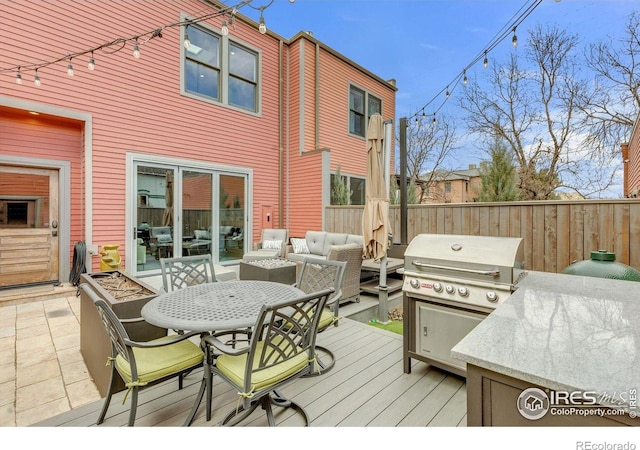 2890 Curtis St, Denver, CO 80205 - deck featuring an outdoor living space, outdoor dining space, fence, and grilling area