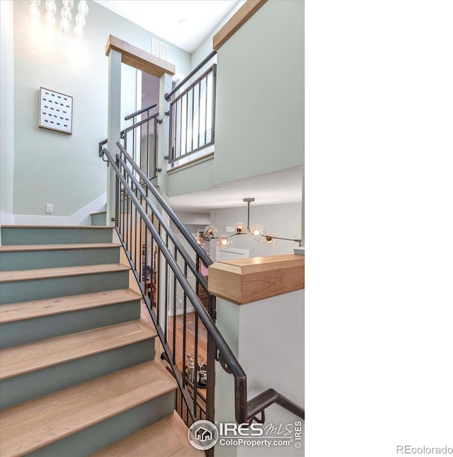 2890 Curtis St, Denver, CO 80205 - staircase featuring a high ceiling