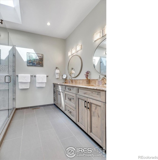 2890 Curtis St, Denver, CO 80205 - bathroom with a shower stall, double vanity, baseboards, tile patterned floors, and recessed lighting