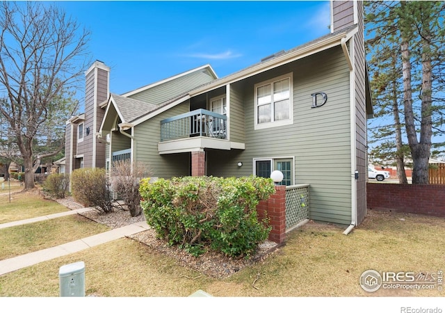 3565 Windmill Dr Unit 3, Fort Collins, CO 80526 - rear view of property featuring a balcony and a chimney
