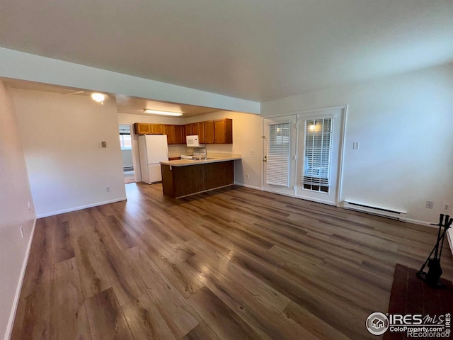 3565 Windmill Dr Unit 3, Fort Collins, CO 80526 - unfurnished living room featuring a baseboard radiator, dark wood-style floors, and baseboards
