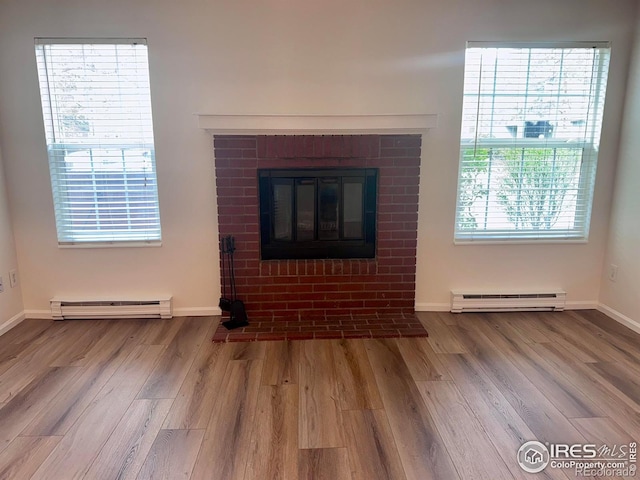 3565 Windmill Dr Unit 3, Fort Collins, CO 80526 - detailed view of baseboard heating, wood finished floors, and baseboards