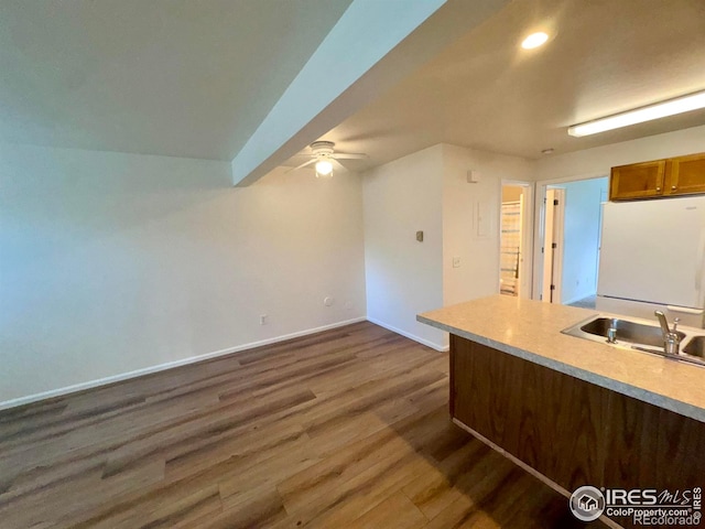 3565 Windmill Dr Unit 3, Fort Collins, CO 80526 - kitchen featuring freestanding refrigerator, baseboards, dark wood-style floors, a ceiling fan, and light countertops