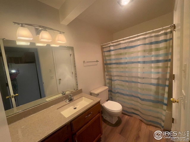 3565 Windmill Dr Unit 3, Fort Collins, CO 80526 - full bathroom with wood finished floors, vanity, toilet, and curtained shower