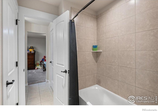 full bathroom with tile patterned flooring and shower / bath combo with shower curtain