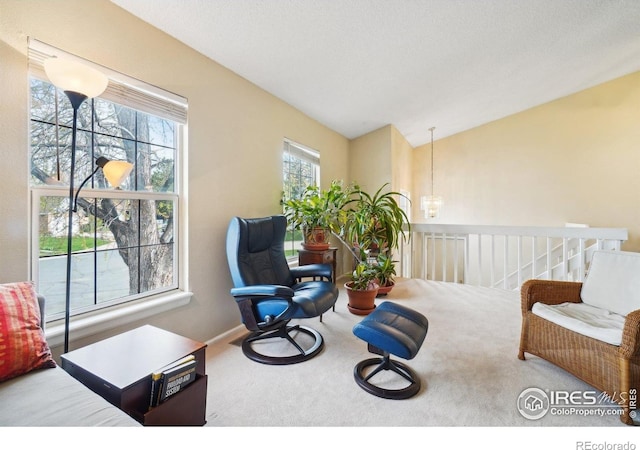 13755 W 65th Dr, Arvada, CO 80004 - living area with carpet floors, lofted ceiling, and a chandelier