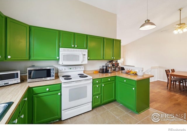 13755 W 65th Dr, Arvada, CO 80004 - kitchen with white appliances, vaulted ceiling, light countertops, a peninsula, and a ceiling fan
