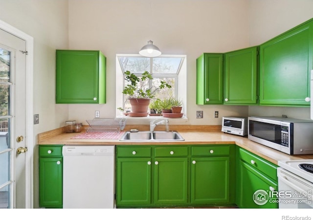 13755 W 65th Dr, Arvada, CO 80004 - kitchen with white appliances, a sink, light countertops, and pendant lighting