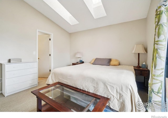 13755 W 65th Dr, Arvada, CO 80004 - bedroom featuring a skylight, vaulted ceiling, and carpet flooring