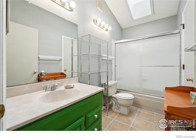 13755 W 65th Dr, Arvada, CO 80004 - full bathroom with tile patterned flooring, vanity, toilet, and shower / bath combination with glass door