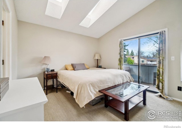 13755 W 65th Dr, Arvada, CO 80004 - bedroom featuring a skylight, access to outside, vaulted ceiling, and light carpet