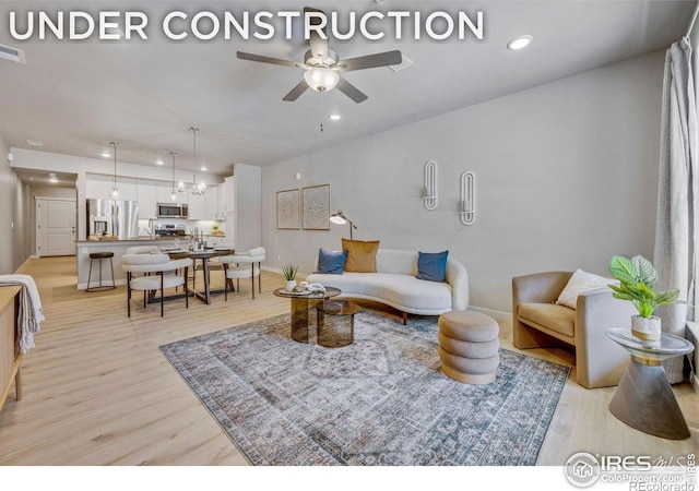 968 Birdwhistle Ln Unit 6, Fort Collins, CO 80524 - living room featuring a ceiling fan, light wood-style floors, recessed lighting, and baseboards