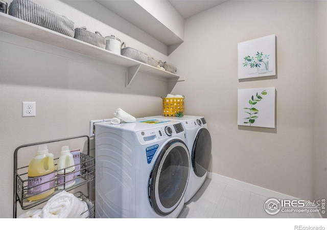 968 Birdwhistle Ln Unit 6, Fort Collins, CO 80524 - laundry room featuring washer and dryer and baseboards