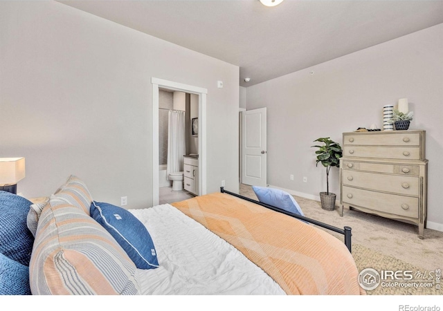 968 Birdwhistle Ln Unit 6, Fort Collins, CO 80524 - bedroom featuring light colored carpet, baseboards, and ensuite bath
