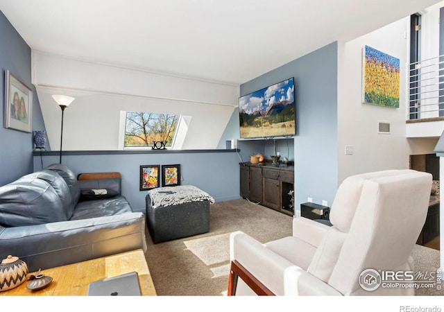 511 Spindrift Ct, Fort Collins, CO 80525 - living area featuring carpet flooring, visible vents, and a healthy amount of sunlight