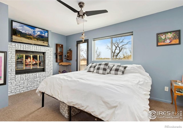 511 Spindrift Ct, Fort Collins, CO 80525 - bedroom featuring baseboards, carpet flooring, ceiling fan, and a fireplace