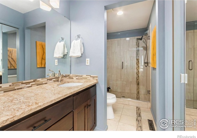 511 Spindrift Ct, Fort Collins, CO 80525 - full bathroom with vanity, tile patterned floors, a shower stall, and toilet