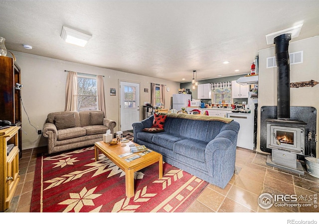 95 Eagle Tree Cir, Red Feather Lakes, CO 80545 - living room with a wood stove, visible vents, and recessed lighting
