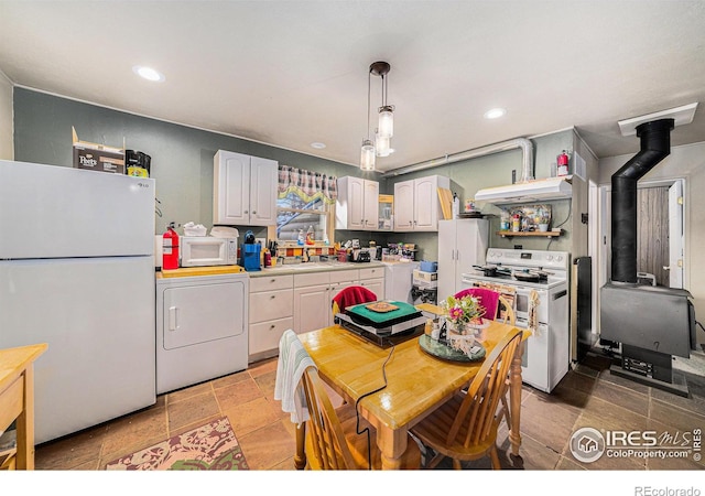 95 Eagle Tree Cir, Red Feather Lakes, CO 80545 - kitchen with recessed lighting, light countertops, washer / clothes dryer, and white appliances