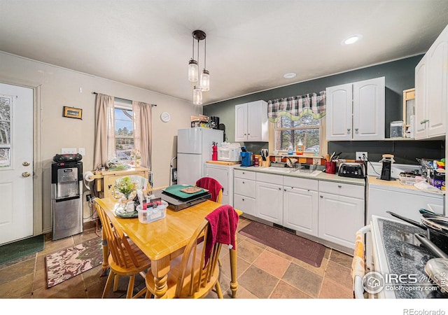 95 Eagle Tree Cir, Red Feather Lakes, CO 80545 - kitchen with a sink, white cabinetry, white appliances, light countertops, and recessed lighting