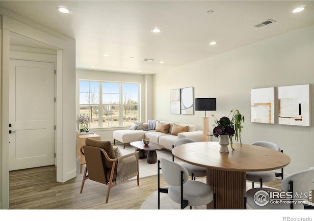 living room featuring light wood-style floors and recessed lighting