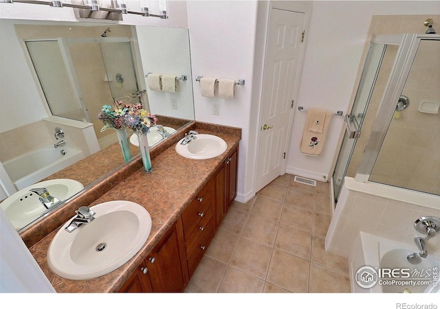 355 47th Ave Unit A, Greeley, CO 80634 - bathroom featuring a sink, a shower stall, a garden tub, and visible vents