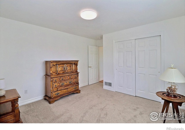 355 47th Ave Unit A, Greeley, CO 80634 - carpeted bedroom featuring visible vents, baseboards, and a closet