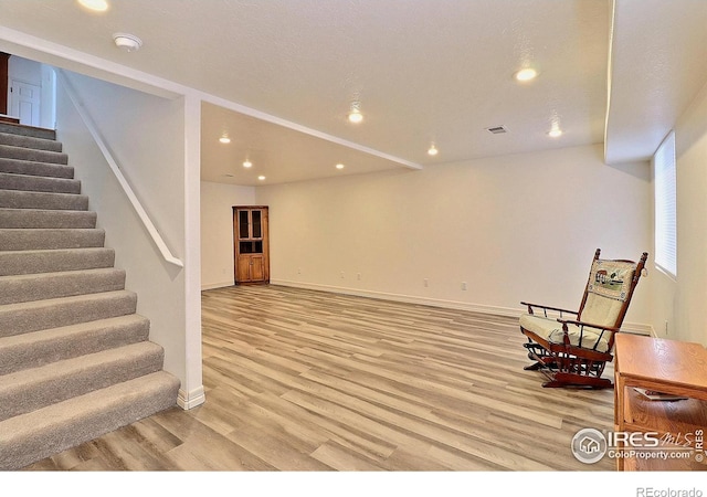 355 47th Ave Unit A, Greeley, CO 80634 - unfurnished room with recessed lighting, baseboards, light wood-style flooring, and stairway
