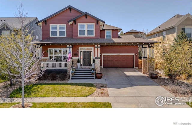 craftsman inspired home featuring covered porch, an attached garage, driveway, and roof with shingles