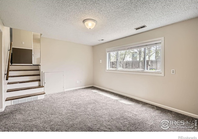 1352 S Terry St, Longmont, CO 80501 - empty room featuring carpet floors, baseboards, and visible vents