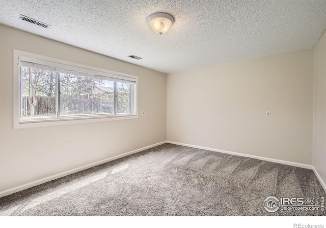 1352 S Terry St, Longmont, CO 80501 - empty room with baseboards, visible vents, and carpet