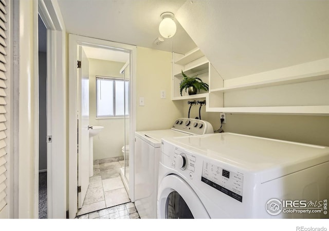 1352 S Terry St, Longmont, CO 80501 - laundry room featuring washer and dryer and laundry area