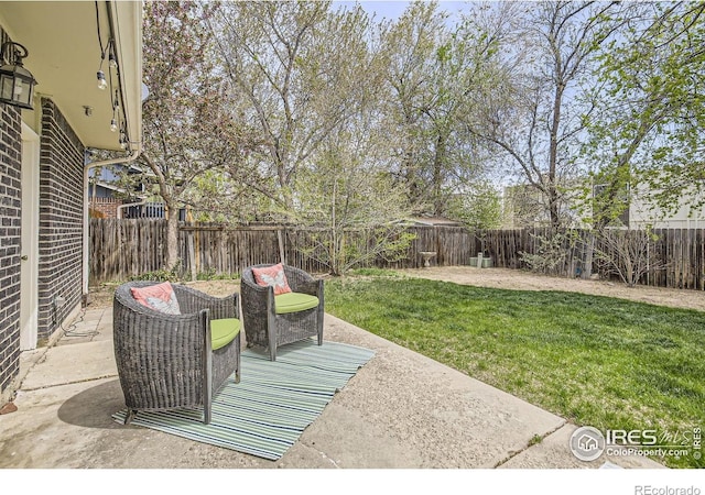 1352 S Terry St, Longmont, CO 80501 - view of patio featuring a fenced backyard