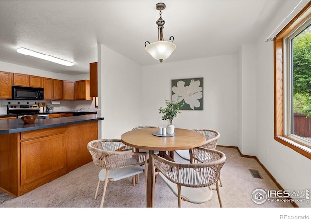 2476 Forsythia Dr, Loveland, CO 80537 - dining space with baseboards and visible vents