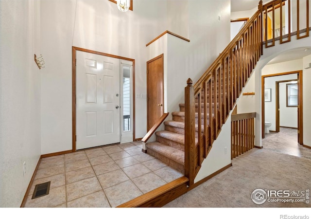 2476 Forsythia Dr, Loveland, CO 80537 - foyer with visible vents, arched walkways, and baseboards