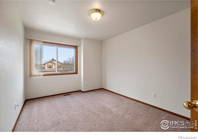 2476 Forsythia Dr, Loveland, CO 80537 - unfurnished room with visible vents, carpet, and baseboards